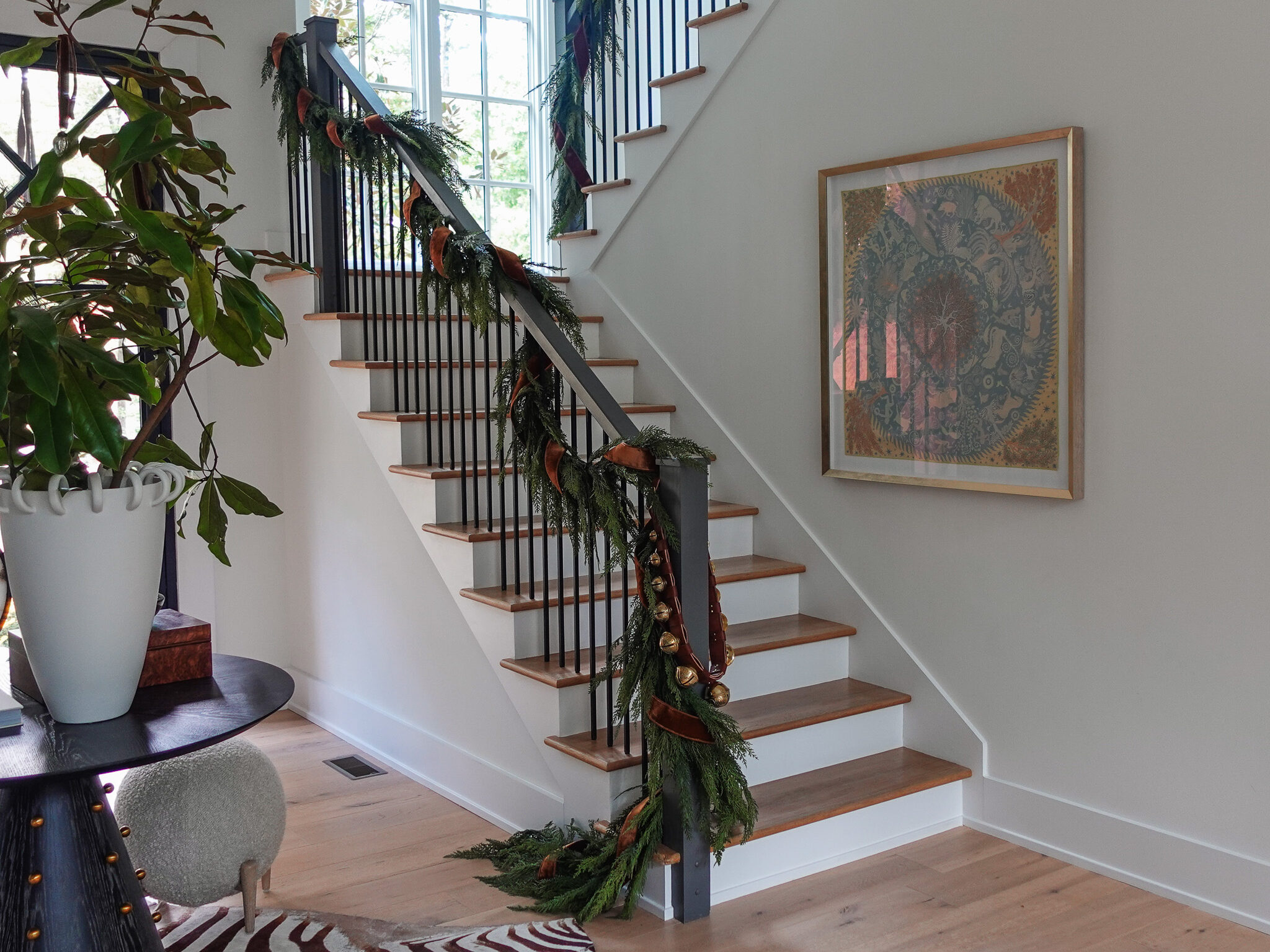 Styled stair shot with garland for holiday decor must-haves