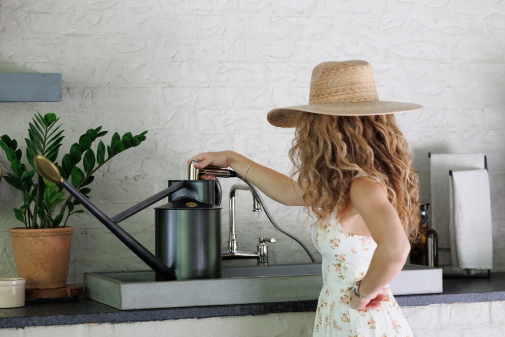 Ashley filling up her watering can 